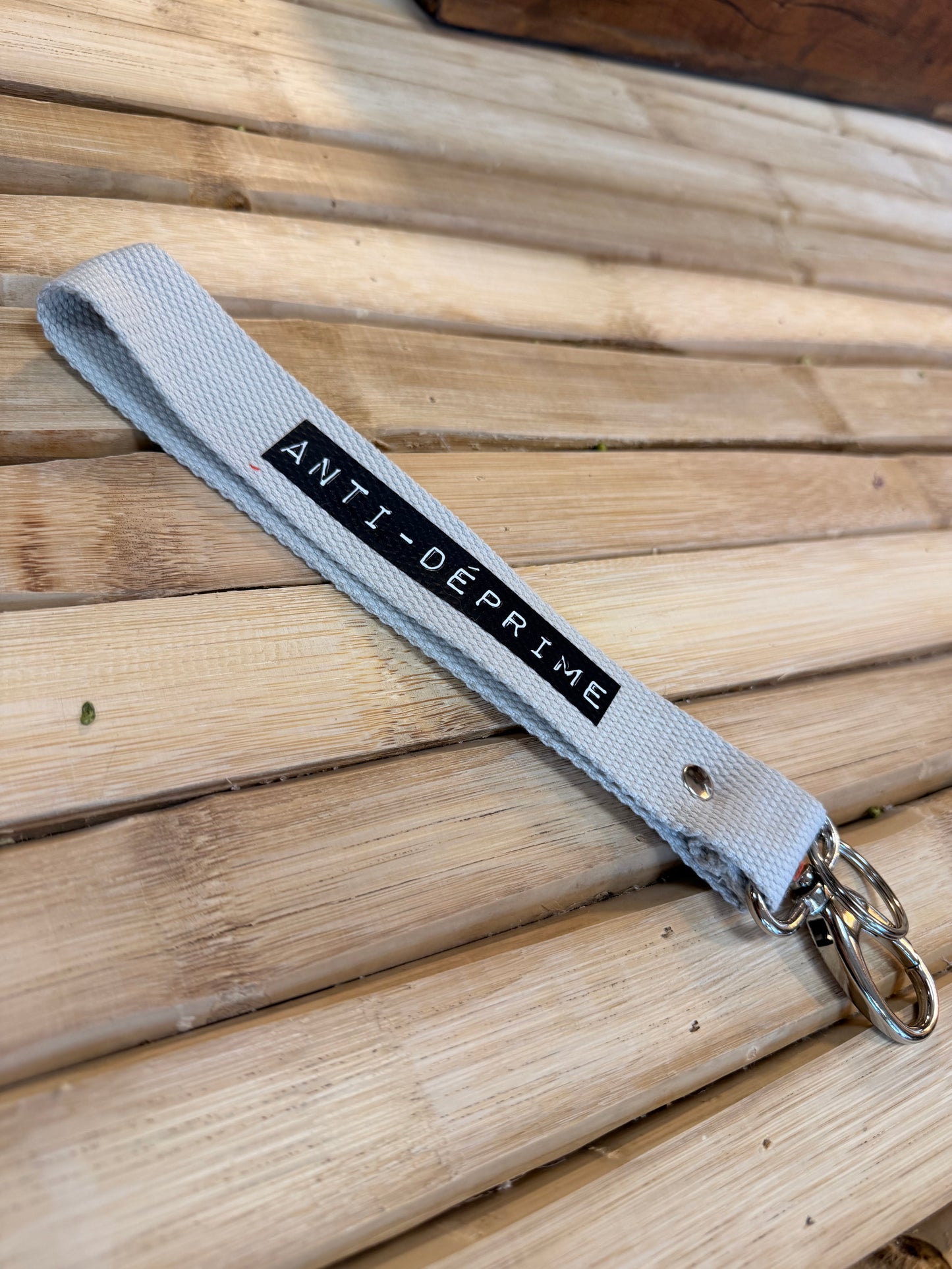 Sangle sable/ dymo noir - Anti-déprime